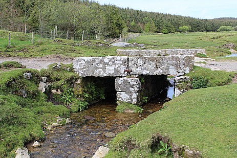Stone clapper bridge over a stream Bodmin Moor Cornwall